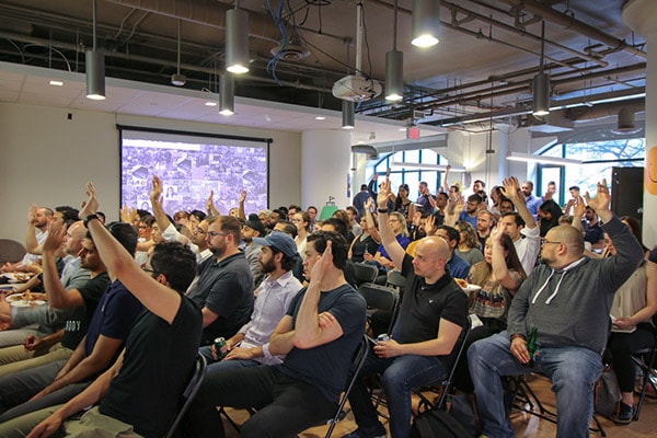 audience raising their hands