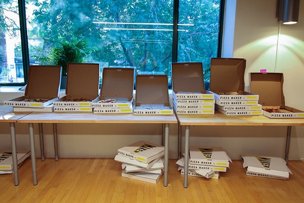 table of 20 pizza boxes